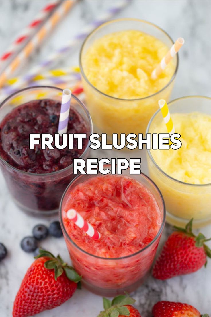 fruit slushies in small glasses with strawberries and blueberries on the side