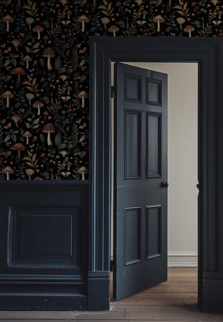 an open door leading into a room with wallpaper