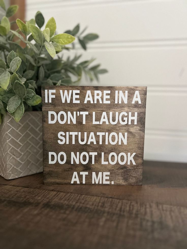 a wooden sign that says if we are in a don't laugh situation do not look at me