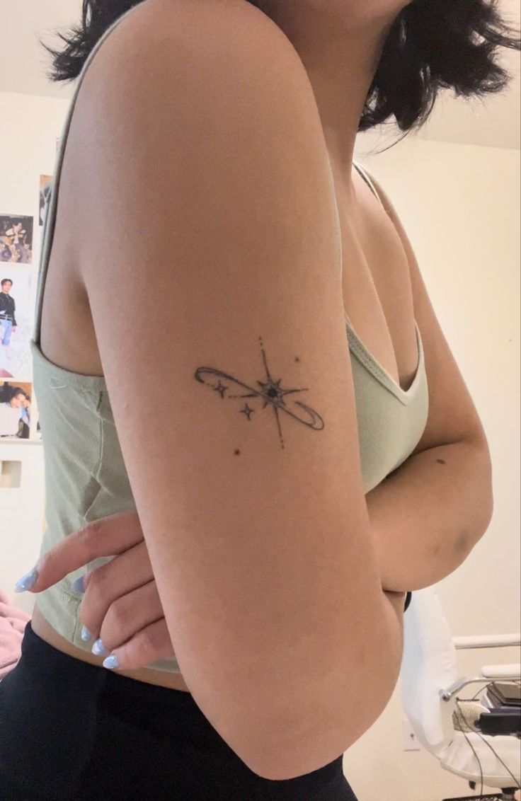 a woman with a small tattoo on her arm