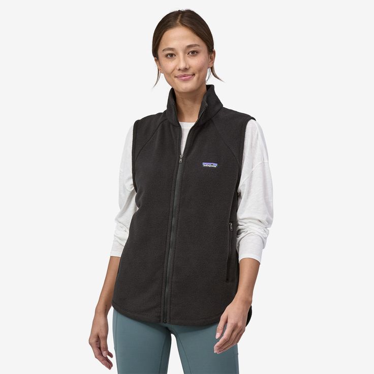 An easy-to-wear wardrobe classic, this vest has simple styling and can be layered or worn alone. Made of lower-impact, lightweight 100% recycled polyester fleece in a relaxed fit, it's a transitional piece that's both functional and flexible for all seasons. Made in a Fair Trade Certified™ factory. 100% Recycled PolyesterThe body fabric of this vest is made of lightweight 100% recycled polyester brushed fleece Mock NeckSimple mock-neck styling with a center-front, full-zip closure Pocket Details Wardrobe Classic, Vest Outfits, Fleece Vest, Denim Leggings, Shorts With Tights, Patagonia Womens, Denim Pant, Kids Tops, Tight Leggings