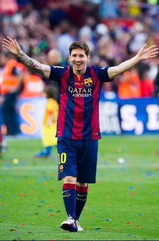 a soccer player with his arms wide open and hands in the air as he walks off the field