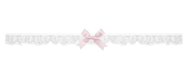 a white lace garter with a pink bow on the front and side, along with a light pink ribbon