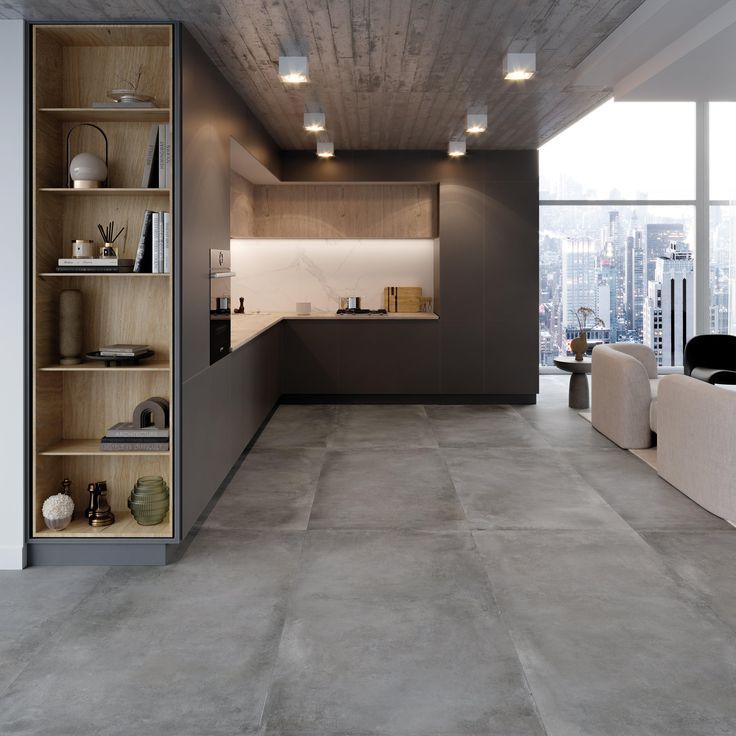 an empty living room with concrete floors and walls