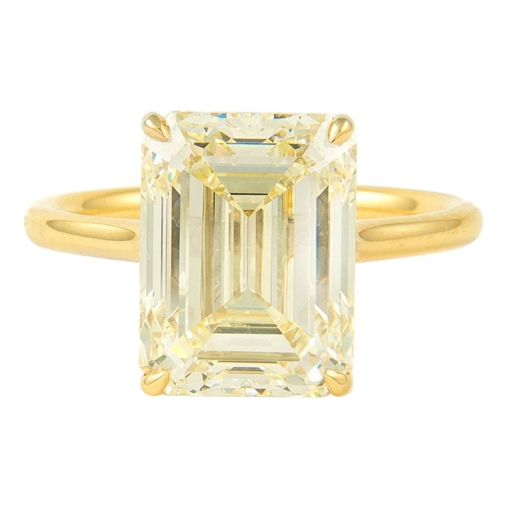 Stunning modern diamond solitaire ring. High jewelry by Alexander Beverly Hills HRD graded 6.02 carat emerald cut diamond, M color grade, and VS2 clarity grade. 18-karat yellow gold, current ring size 6.5. Accommodated with an up to date appraisal by a GIA G.G., please contact us with any questions. Thank you. HRD Report Number 180000169503 Item Number APC1112 Luxury Yellow Gold Emerald Cut Crystal Ring, Formal Emerald Ring With Radiant Cut And Vvs Clarity, Octagon Yellow Gold Emerald Ring With Vvs Clarity, Yellow Baguette Cut Diamond Ring With Vvs Clarity, Classic Yellow Diamond Ring With Vvs Clarity, Luxury Gia Certified Octagon Diamond Ring, Yellow Emerald Cut Diamond Ring, Yellow Gold Emerald Ring With Radiant Cut Diamond, Modern Gia Certified Emerald Cut Diamond Ring