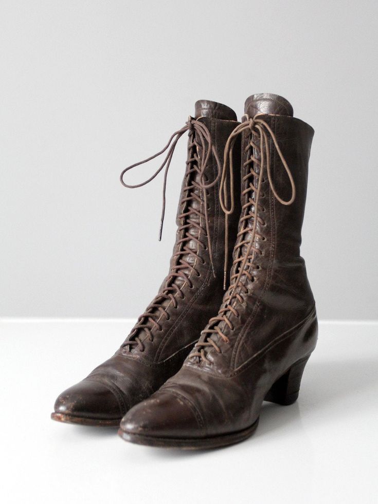 "This is a pair of antique Victorian era leather boots. The brown lace up boots feature a high wood heel and pointed toe. CONDITION In good condition with wear consistent with age and use. Scuff and scratches around the feet. The left shoe base heel pad has uneven wear from use. Approximate Fit: US 7 or 7.5 MEASUREMENTS Wall to Toe Length: 10\" ... 25.4 cm Width: 3\" ... 7.6 cm Height: 9.5\" ... 24.1 cm Heel: 2\" ... 5.1 cm HOW WE MEASURE * Wall to toe measures the length with the shoe heel agai Brown Lace Up Boots, Women's Lace Up Boots, Victorian Shoes, Victorian Boots, Hippie Boots, Pointed Boots, Wood Heel, Vintage Clothing Online, Victorian Era