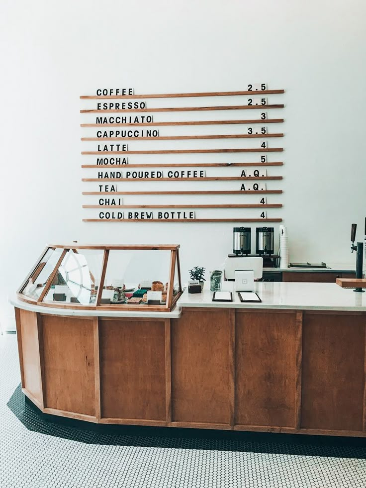 a coffee shop counter with lots of different items on it