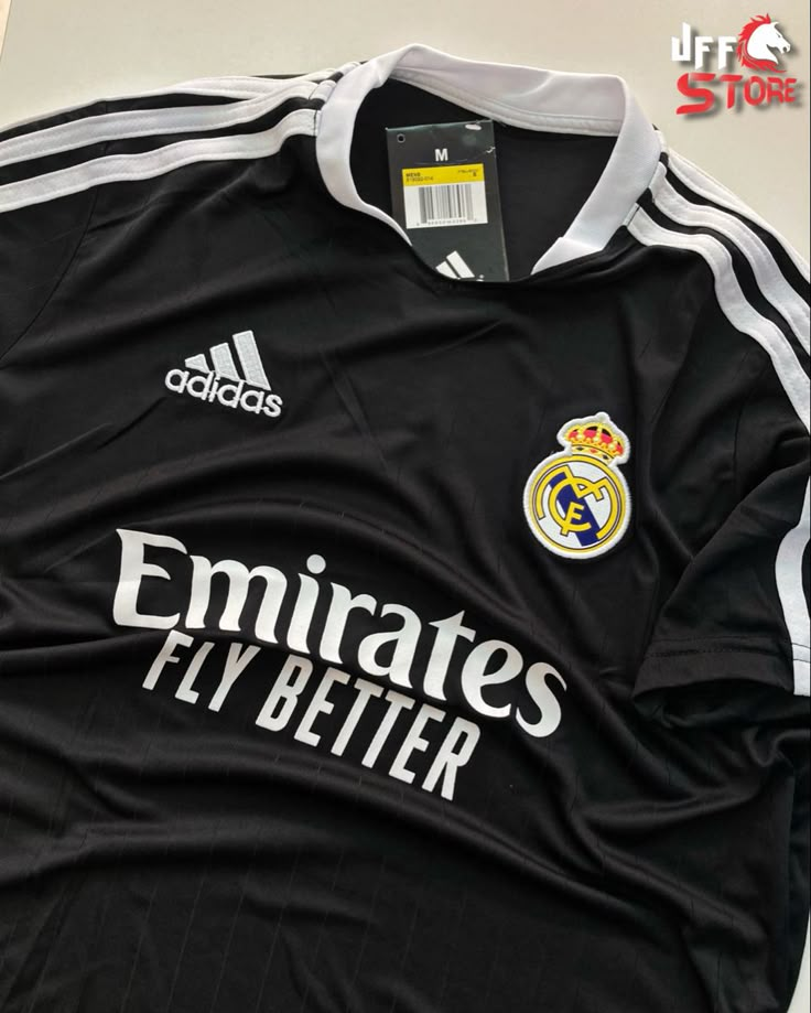 an adidas jersey with the real madrid logo on it