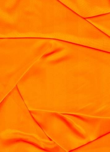 an orange fabric with very thin folds