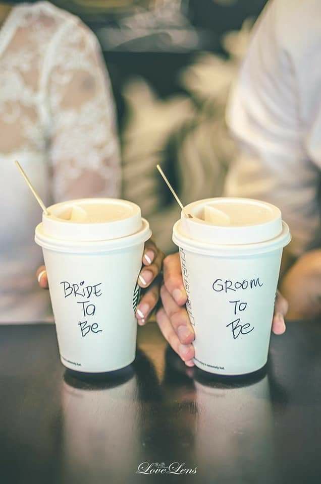 two people holding coffee cups with the words welcome to me written on them