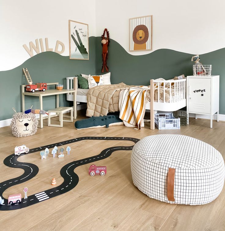 a child's bedroom with toy cars and toys on the floor