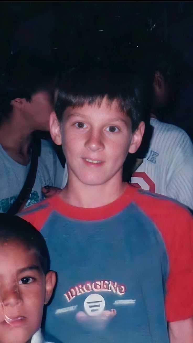 two young boys sitting next to each other