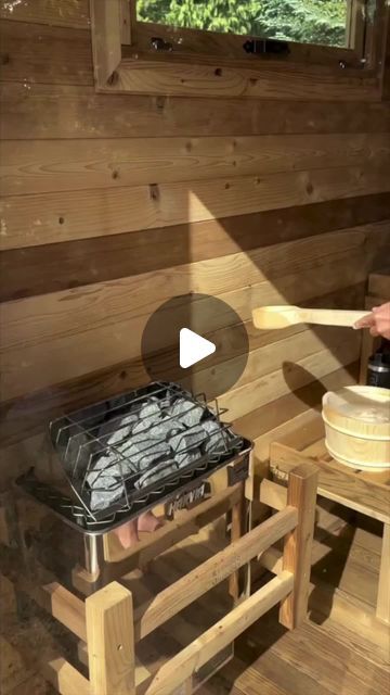 a person cooking food in a wooden cabin