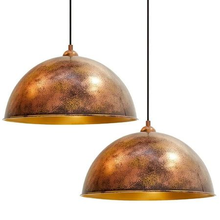 two copper colored lights hanging from the ceiling with one light on each side and one in the middle