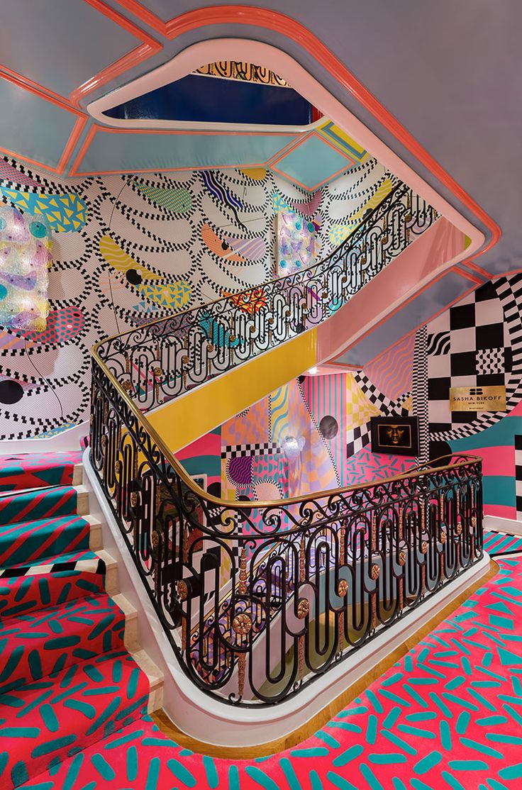 an artisticly designed stair case in a brightly colored room