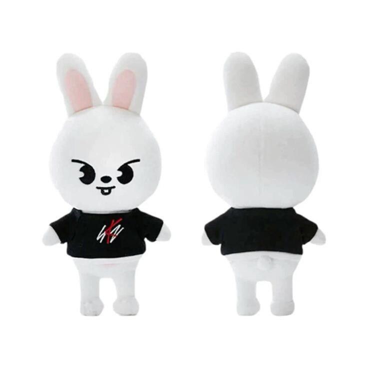 two white stuffed animals wearing black shirts