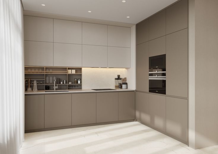 an empty kitchen with beige cabinets and counter tops