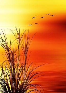 birds flying over the water at sunset with tall grass in foreground and orange sky