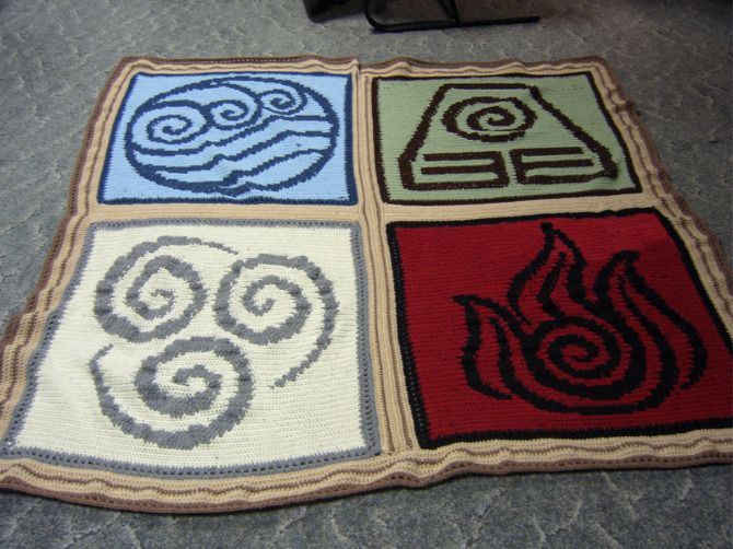 four squares with different designs on them sitting on the floor in front of a chair