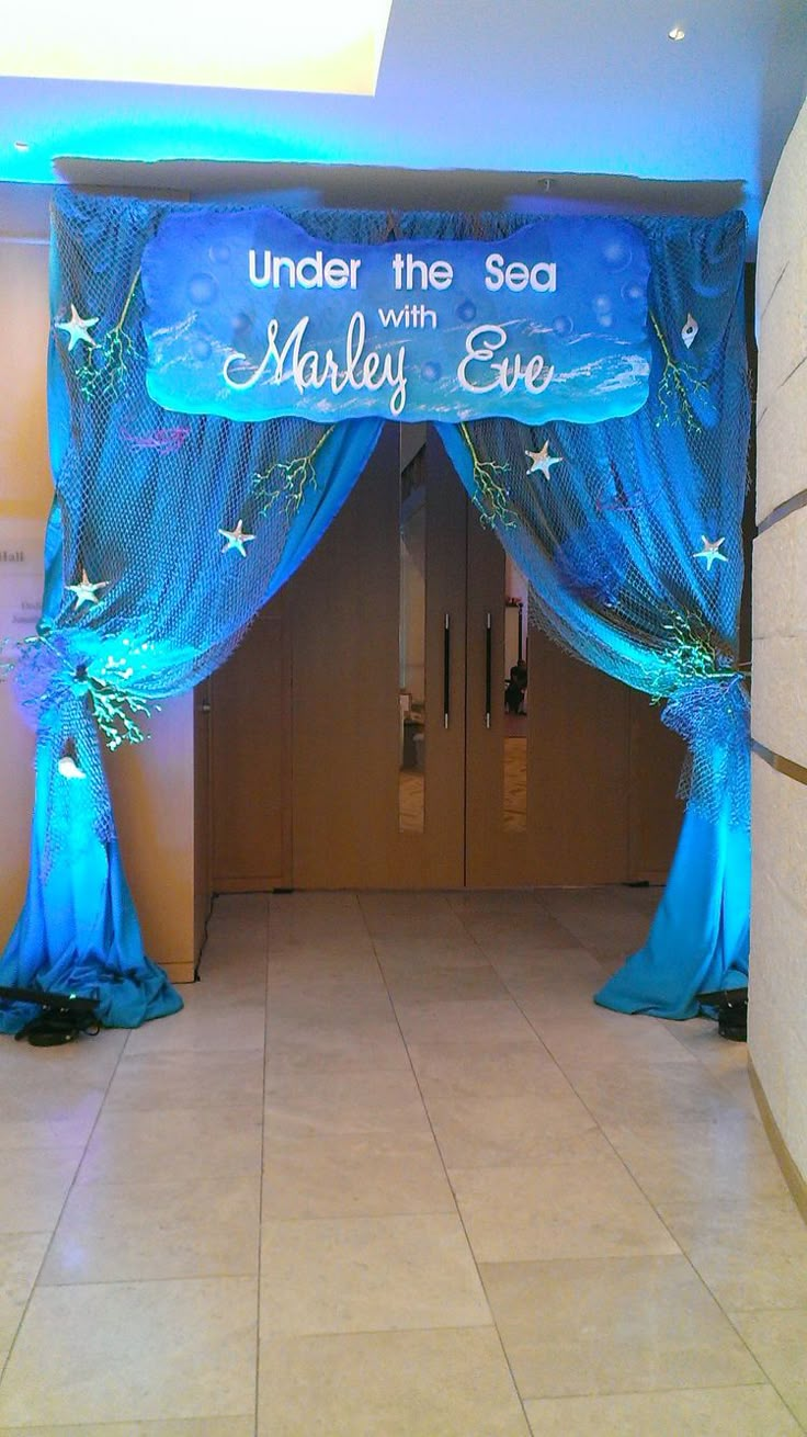 under the sea with madly eye stage set up for an event or party, it looks like something out of a fairy tale