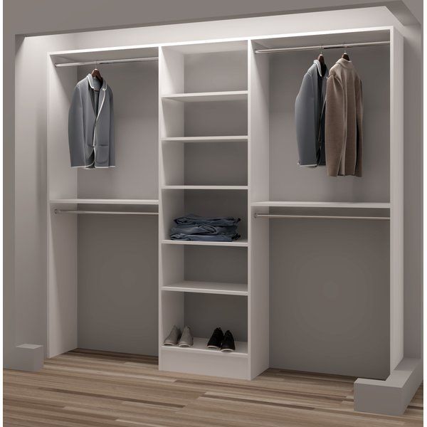 an open white closet with clothes and shoes on the shelves, next to a wooden floor