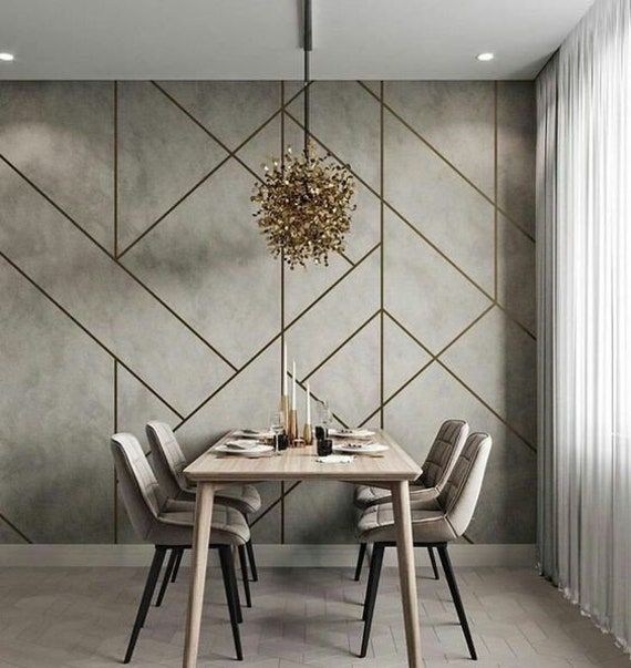 a dining table with chairs and a chandelier hanging from the ceiling