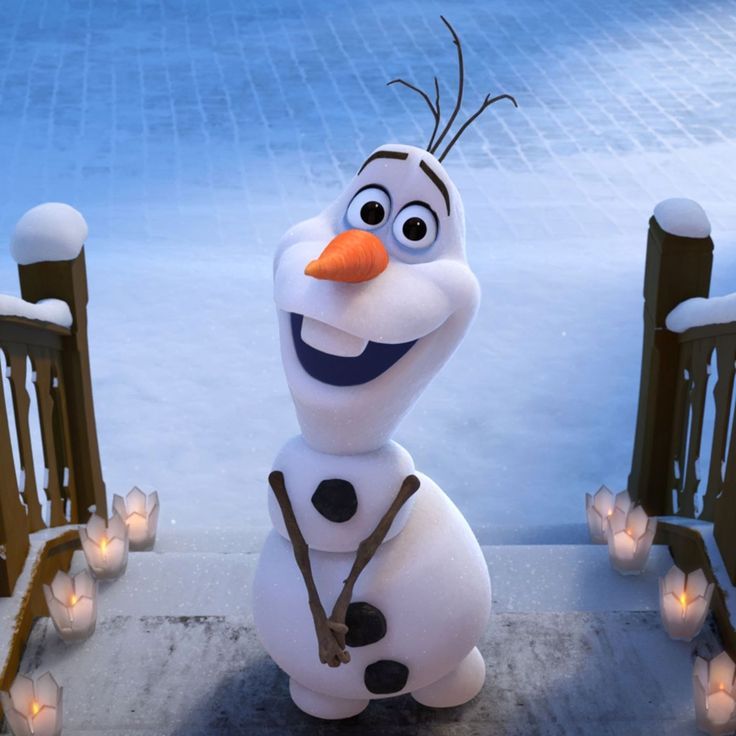 a snowman is standing in front of some candles