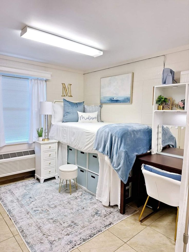 a bed room with a neatly made bed and a desk