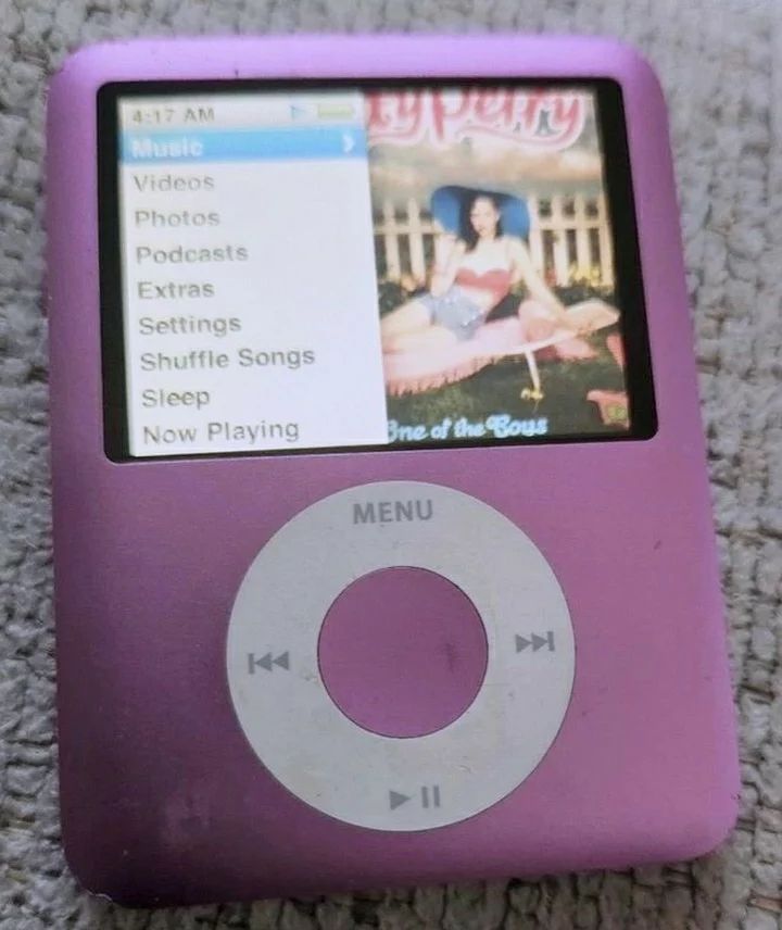 an ipod sitting on top of a carpet