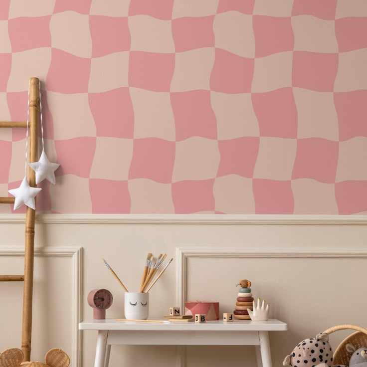 a pink and white checkered wall in a child's room