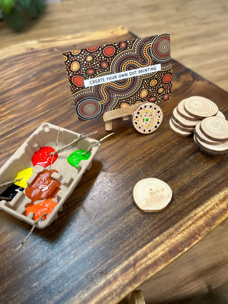 a wooden table topped with lots of different types of candies and cookies on top of it