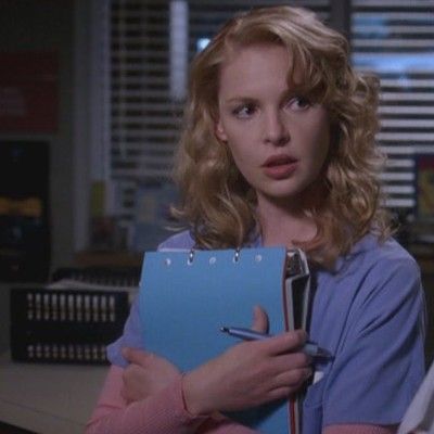 a woman holding a clipboard in an office