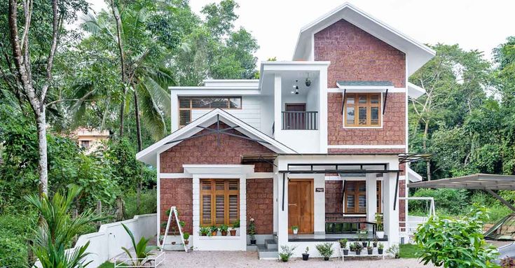 a small house in the middle of some trees and plants on the side of it