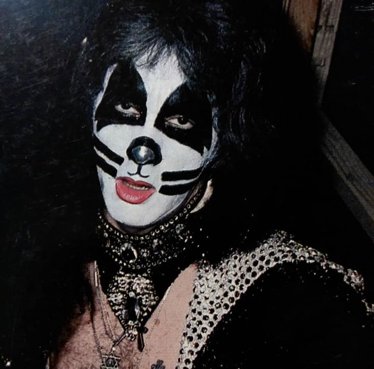 a man with black and white makeup on his face