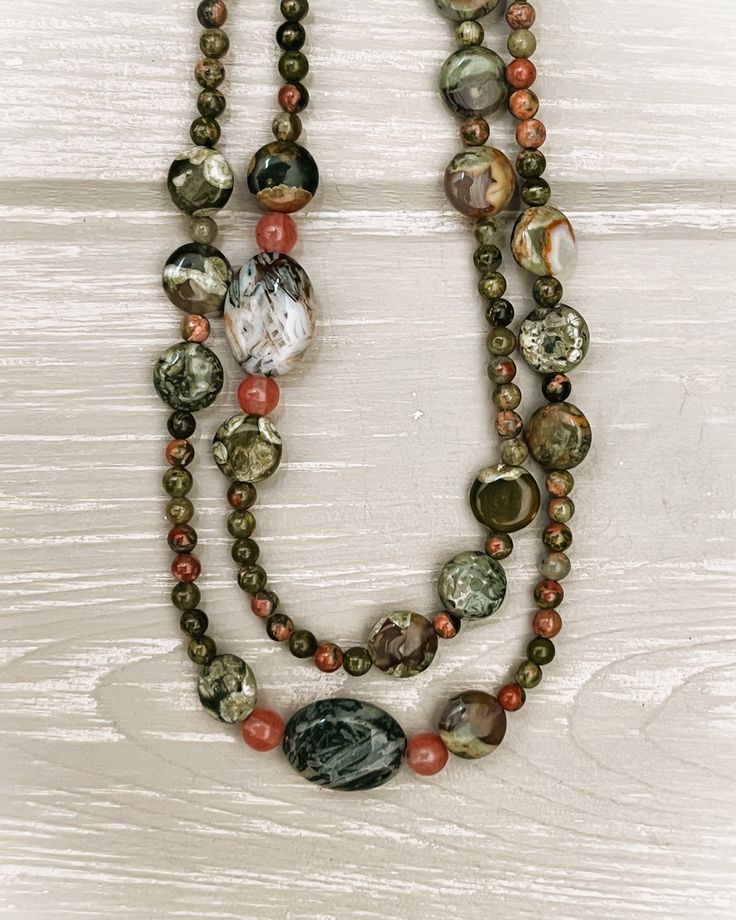 A necklace designed with variegated mossy-green beads and natural inclusions of peach, orange, and white. May be worn as a single or double strand. A copper toggle clasp is attached. Green Jasper Necklaces With Natural Stones, Earthy Green Jasper Necklaces, Hand-strung Jasper Bead Necklaces, Bone Crafts, Necklace Ideas, Chunky Beads, Pretty Jewelry, Jewelry Pins, A Necklace