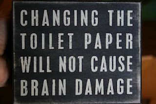 a black and white sign that says changing the toilet paper will not cause brain damage