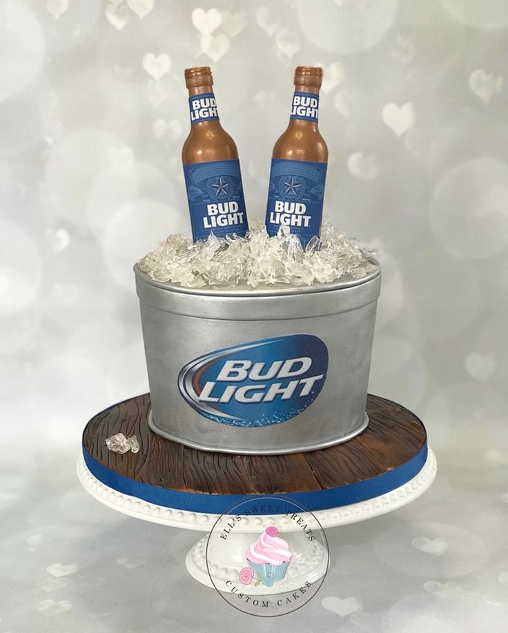 two bud light beer bottles in a bucket cake