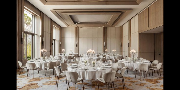 a large banquet room with tables and chairs