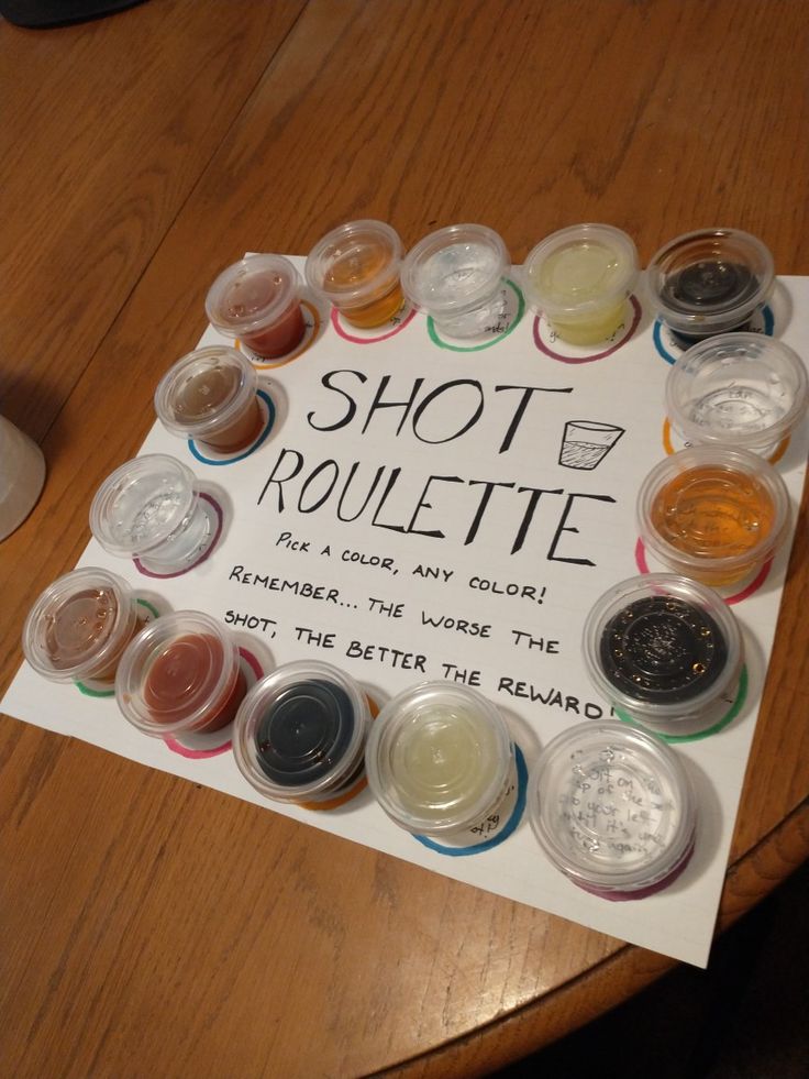 there is a sign that says shot rouleette on the table next to it