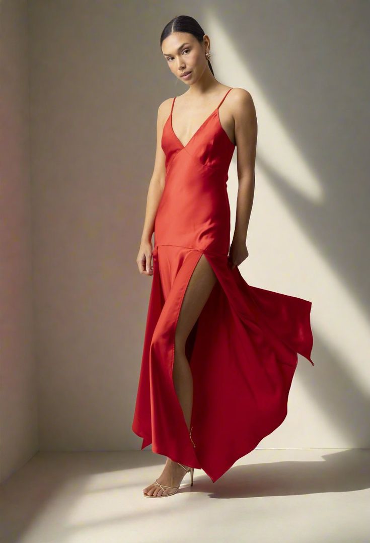 Make a bold statement in the Reseda Dress by Line and Dot! This stunning scarlet midi dress is crafted from luxurious satin-like material and features a playful design that accentuates your curves. The dress boasts a bold peek-a-bo detail in the skirt, with slits on both sides for a touch of feminine charm. It also features a deep V neck for added style. Pair it with strappy heels and an evening bag for your next special occasion! Composition and Fit: True to size Deep V neck Spaghetti Straps Do Charm It, Dress Red, Playful Design, Strappy Heels, Deep V Neck, Scarlet, Both Sides, Red Dress, Spaghetti Strap