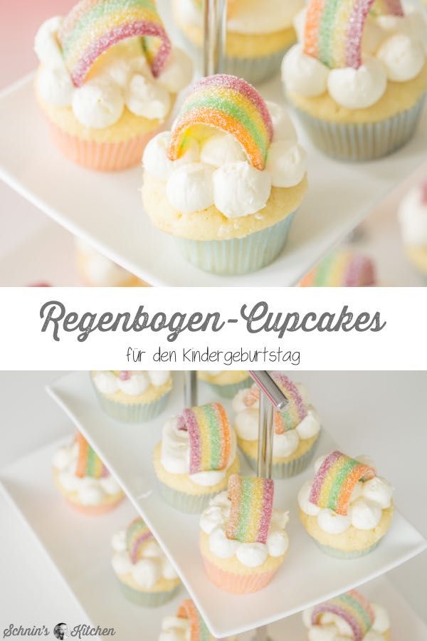 rainbow cupcakes with white frosting and colorful icing are on display for the camera