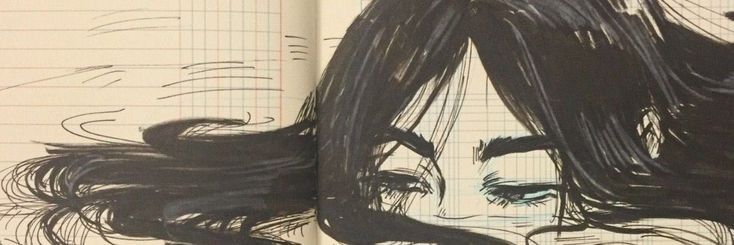 an open book with a drawing of a woman's face in black and white