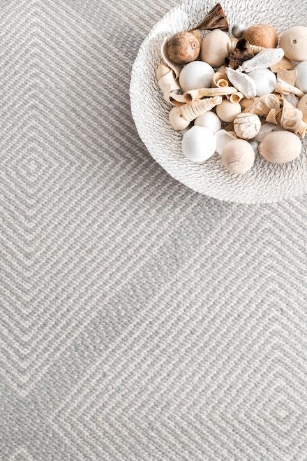 a bowl filled with shells on top of a table