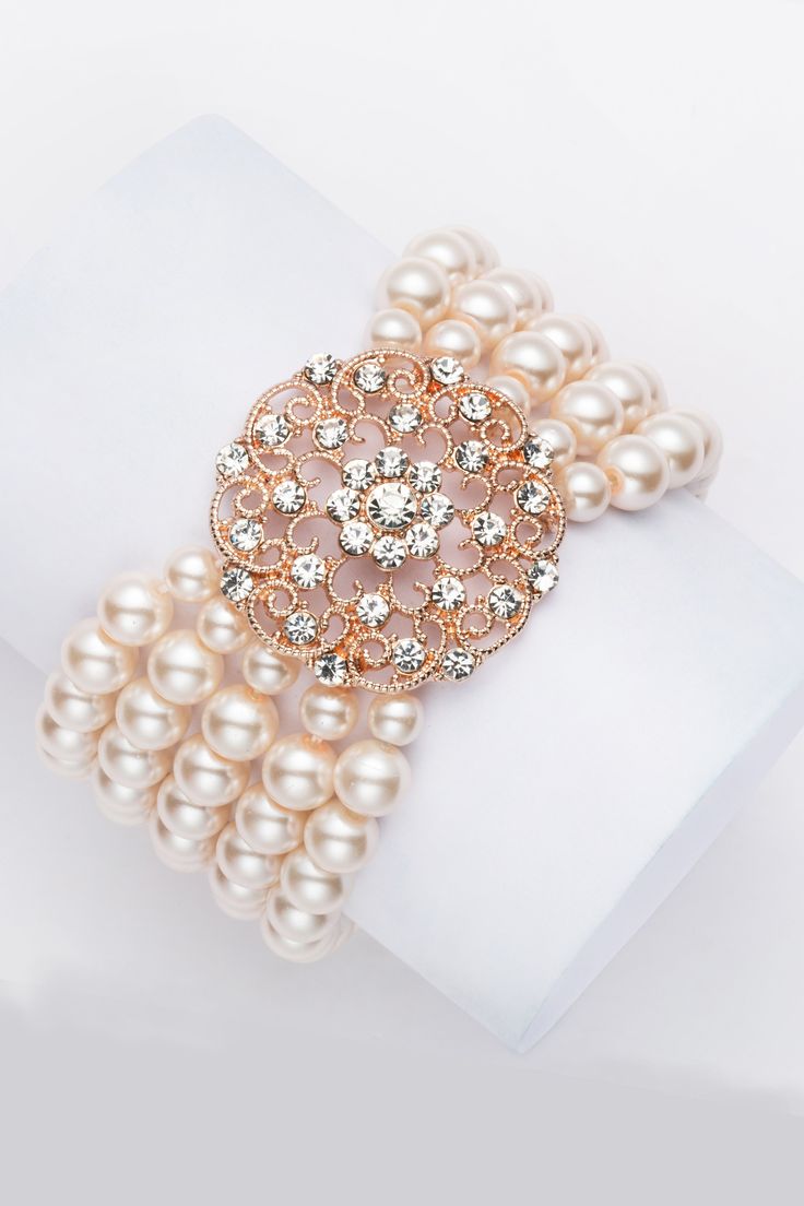 This sumptuous piece of jewelry features a retro-elegant yet slightly modern style that complements the lavish garments, reminiscent of the roaring 1920s. Features: High quality Austrian crystals and imitation pearls Five strand design 5.5 inch / 14cm in diameter 8mm pearls Roaring 20s Accessories, After Five Dresses, 1920's Hair, 20s Accessories, 1920s Accessories, Gatsby Headband, 1920s Jewelry, 50th Party, Beaded Evening Bags