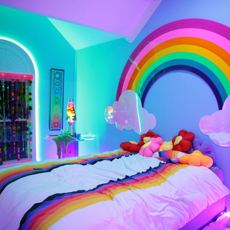 a rainbow themed bedroom is shown in this image