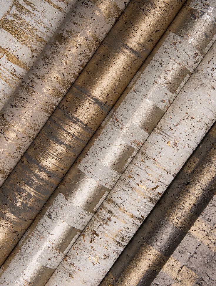 an overhead view of metal pipes with rusted paint on them and the top one is yellow