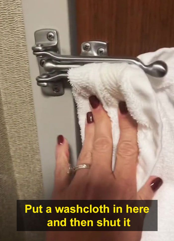 a woman's hand holding onto a towel in front of a door with the words, put a washcloth in here and then shut it