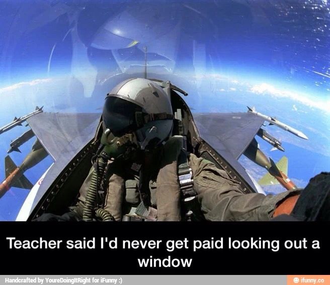 a fighter jet is seen from the cockpit as it flies through the air with its pilot