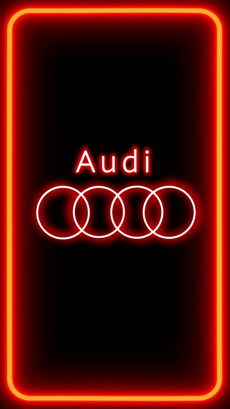 the audi logo is lit up in red and orange neons on a black background