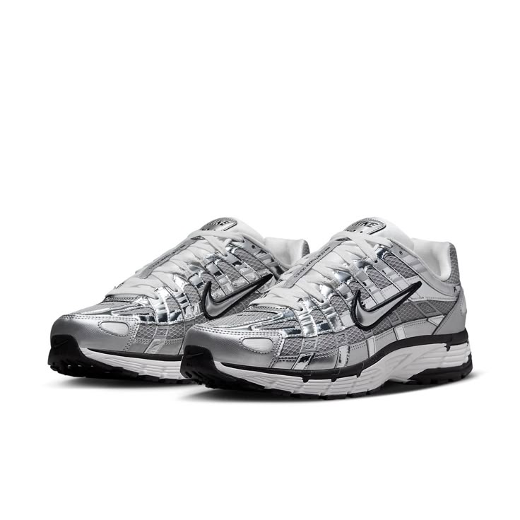 The Nike P-6000 'Metallic Silver' draws inspiration from the 2006 Air Pegasus, infusing it with futuristic flair. Its breathable metallic fabric upper features both vertical and horizontal overlays in chrome synthetic leather, creating a glistening effect. The silver side-panel Nike swoosh is outlined in black embroidery, complementing the black foxing and Nike branding on the tongue tag and heel tab. White laces match the tongue, sock liner, and insole, adorned with P-6000 branding. The comfort Nike P6000, Running Aesthetic, P 6000, Vans Top, Running Cap, Metallic Fabric, Swag Shoes, Nike Acg, Newest Jordans